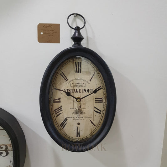 Distressed Black Metal Oval Wall Clock